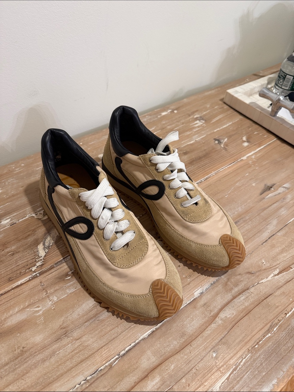Women’s Loewe flow runner sneakers in beige and black suede